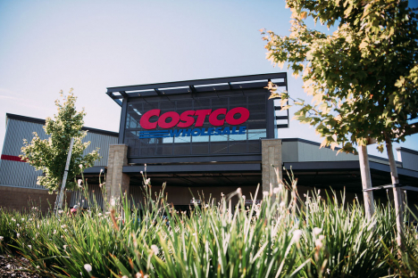 Costco storefront with plants and trees in front